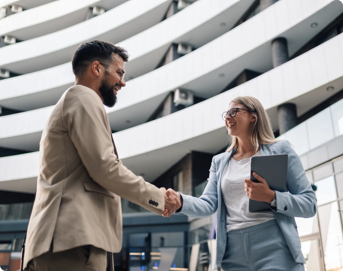 Two people meeting in business attire